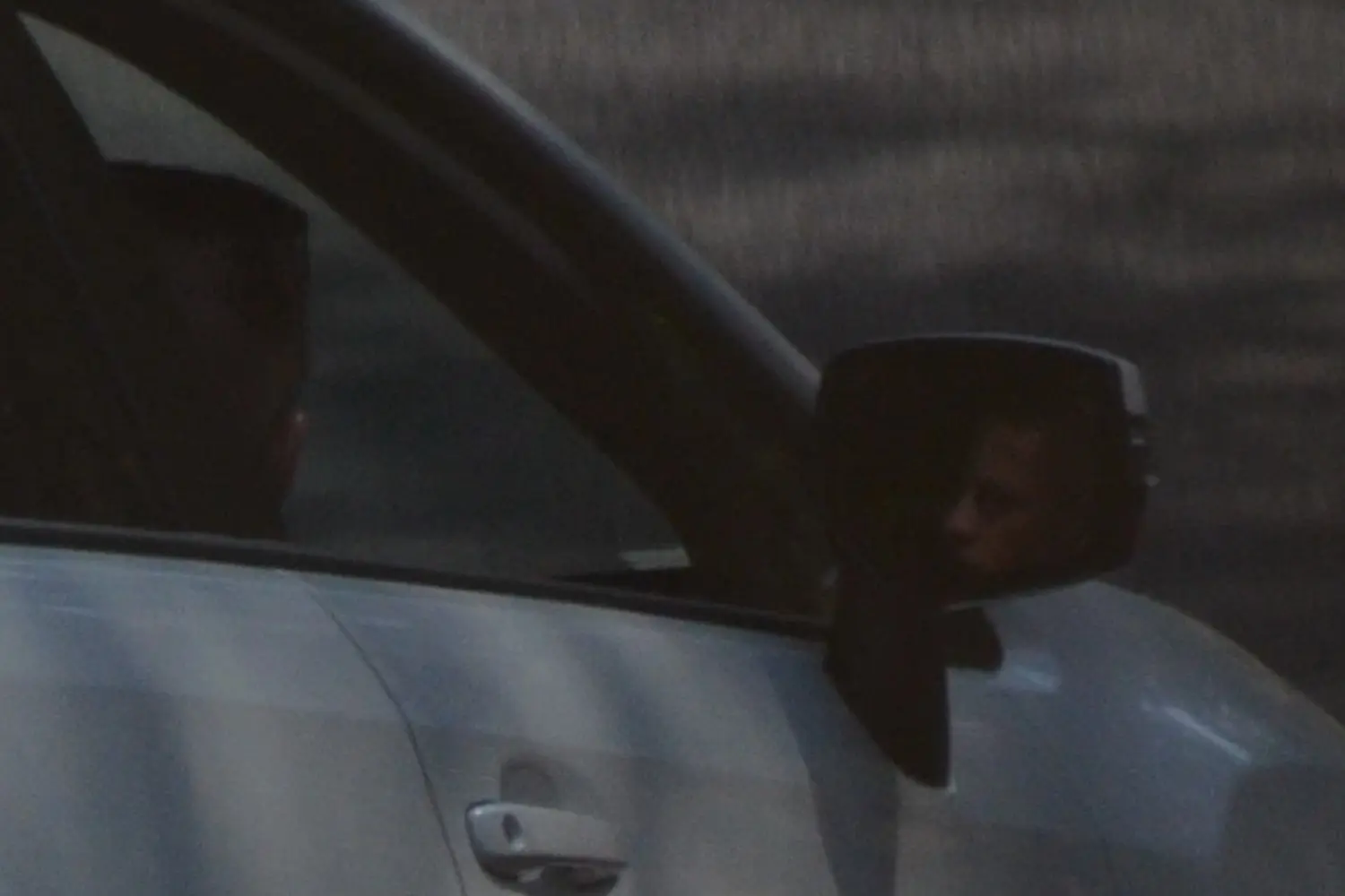 Face Reflected In Car Mirror